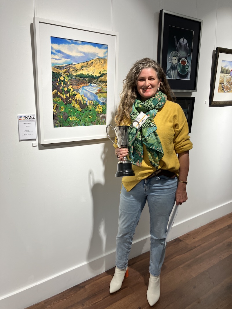 Nicola Warner 2024 winner of the purely pastel exhibition holding the national Purely Pastel Impressions Unison cup